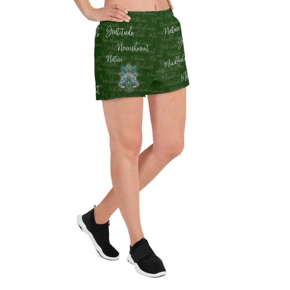 These athletic women's short shorts are so comfy and made from such a versatile fabric that you won't feel out of place at any sports event. The Kristin Zako print is filled with her four pillars phrases and topped off with her logo on the front right leg. Shown in green. Right view.
