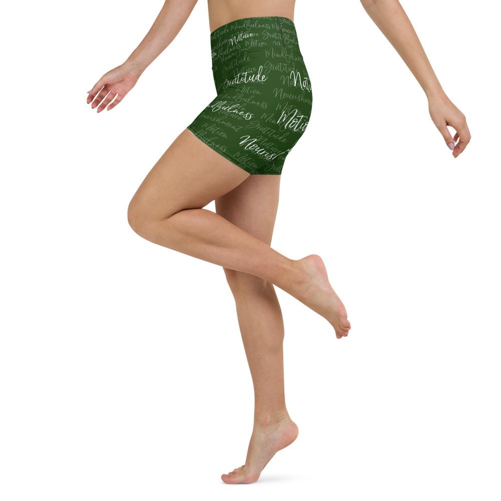 These yoga shorts have a body-flattering fit that will make you feel super comfortable even during the most intense workouts. They come with a high waistband and are made from soft microfiber yarn. The Kristin Zako print is filled with her four pillars phrases and topped off with her logo on the front right leg. Shown in green. Left view.