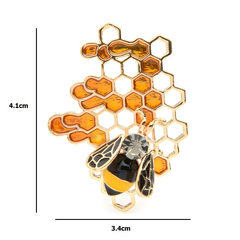 This bee and honeycomb brooch would be a fabulous gift for a bee keeeper. Its  unique design with the enamel filled honeycomb makes it quite modern looking. Dimensions 4.1 x 3.4 cm