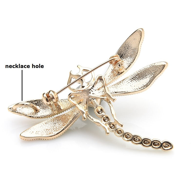 This delicate little dragonfly brooch is a shimmery green with a large green center rhinestone. It can be worn as a pin or attached to a necklace chain using the loop on the back. It's roughly 2" in each dimension. Back view showing loop.