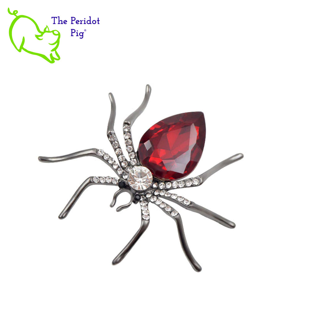 A simple and stylized spider brooch available in 3 different color options. A perfect addition to a scarf or hat. Front view in red.
